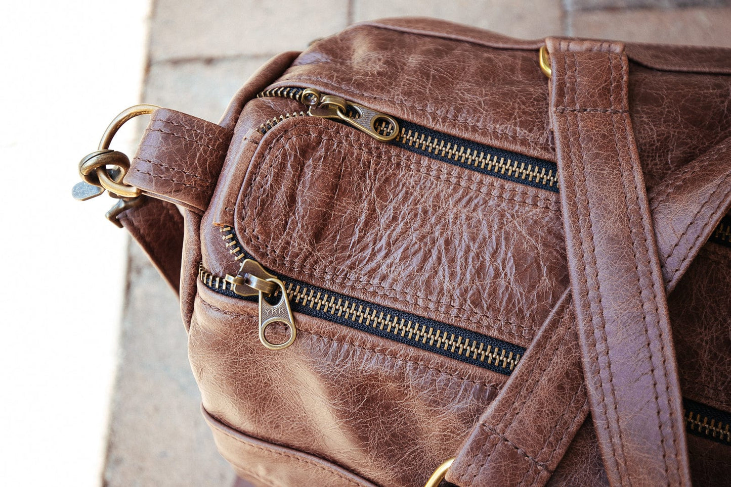 The Real McCaul Travel Bag Classic Overnight Travel Bag - Cowhide - Premium Marble Brown Australian Made Australian Owned Large Overnight Travel Duffel Bag Leather Made in Australia