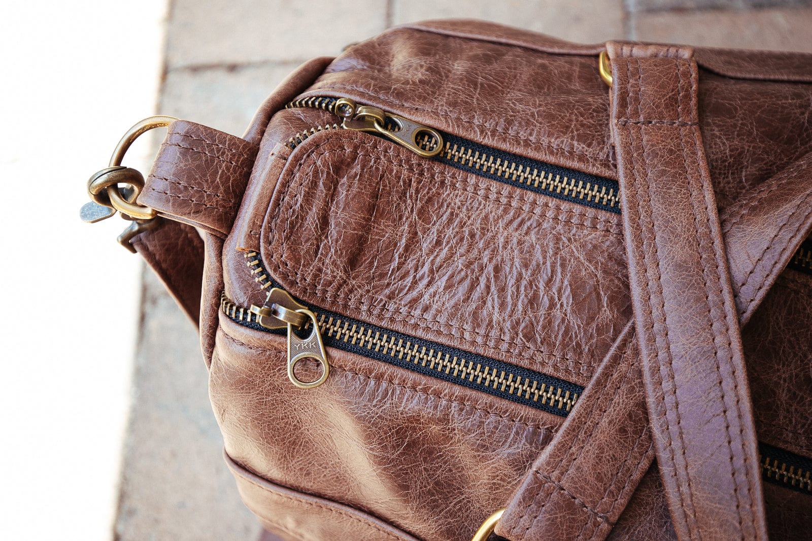 The Real McCaul Travel Bag Classic Overnight Travel Bag - Cowhide - Premium Marble Brown Australian Made Australian Owned Large Overnight Travel Duffel Bag Leather Made in Australia