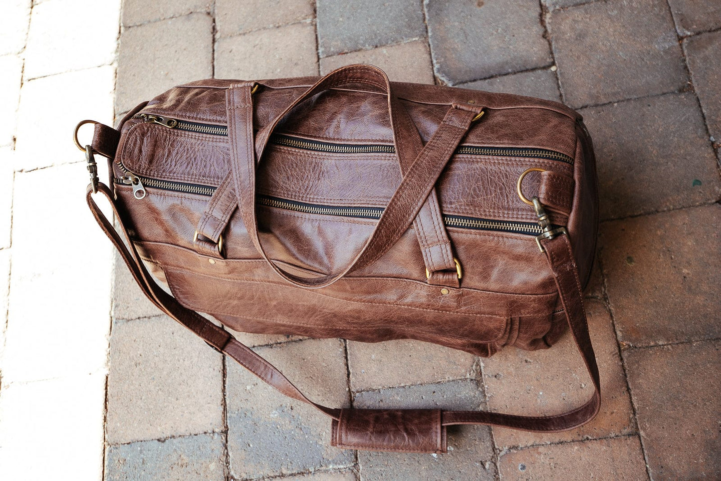 The Real McCaul Travel Bag Classic Overnight Travel Bag - Cowhide - Premium Marble Brown Australian Made Australian Owned Large Overnight Travel Duffel Bag Leather Made in Australia