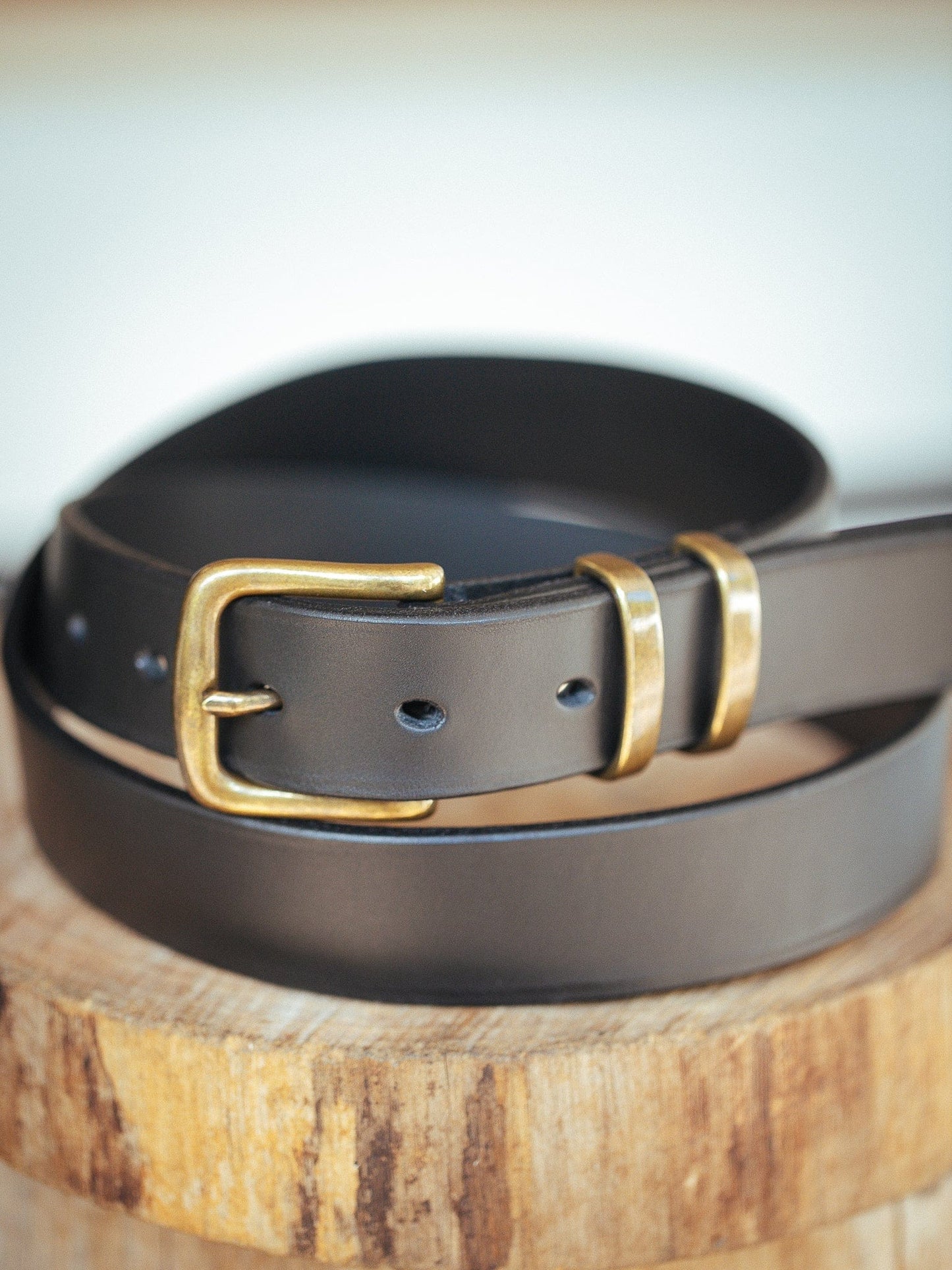 https://www.therealmccaul.com/cdn/shop/products/the-real-mccaul-leathergoods-belts-antique-brass-30-77cm-standard-32mm-belt-double-keeper-black-solid-leather-men-s-belt-handmade-in-australia-brass-buckle-australian-made-australian.jpg?v=1655266077&width=1445